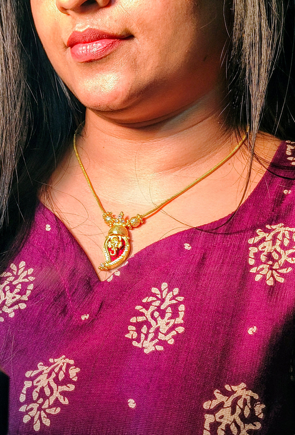 Traditional Handpicked Simple and elegance Ganesh pendant necklace with premium gold finish and royal detailing Jewellery.