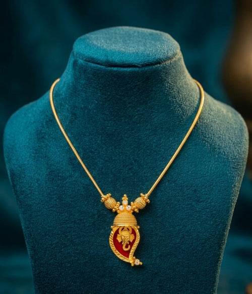 Traditional Handpicked Simple and elegance Ganesh pendant necklace with premium gold finish and royal detailing Jewellery.