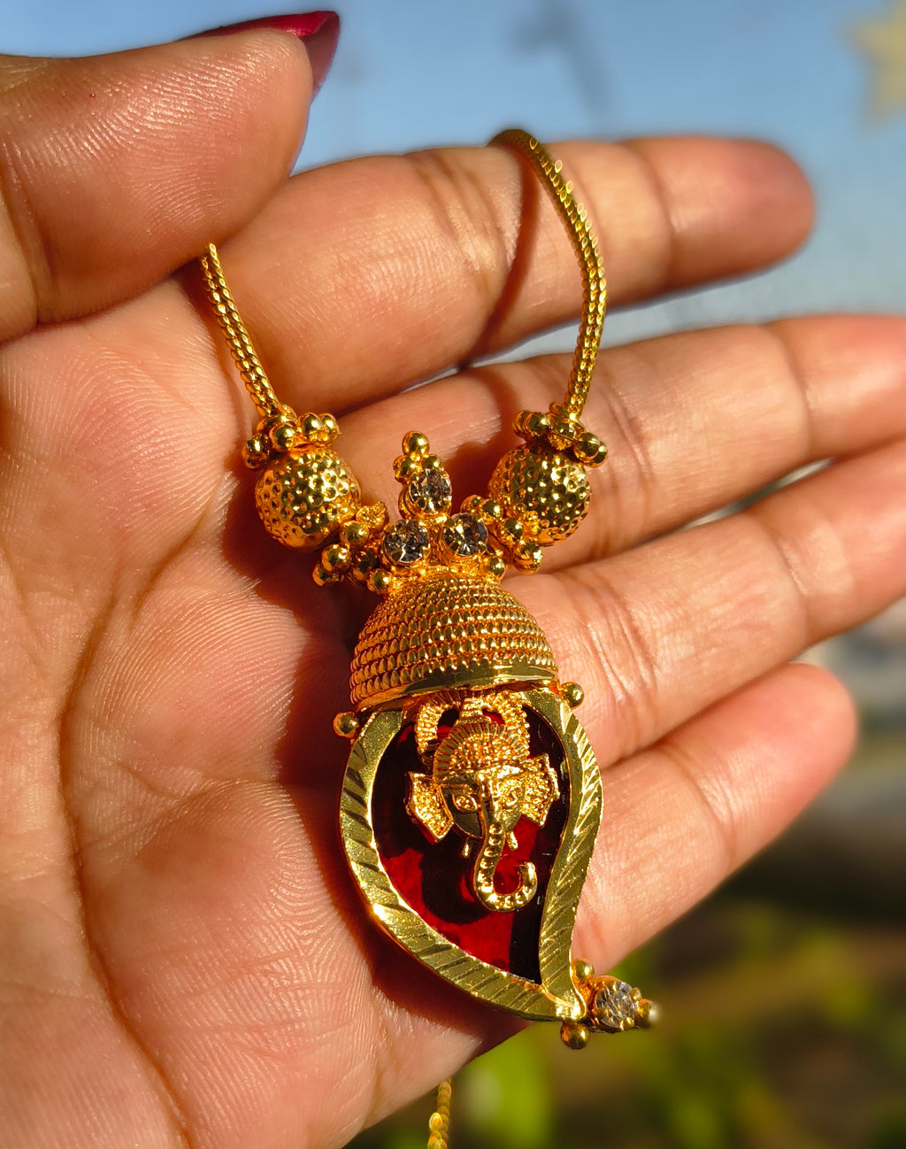 Traditional Handpicked Simple and elegance Ganesh pendant necklace with premium gold finish and royal detailing Jewellery.
