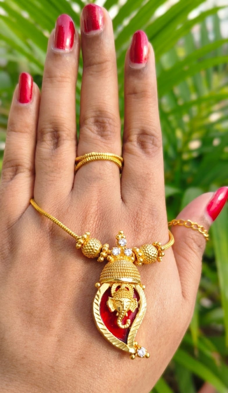 Traditional Handpicked Simple and elegance Ganesh pendant necklace with premium gold finish and royal detailing Jewellery.