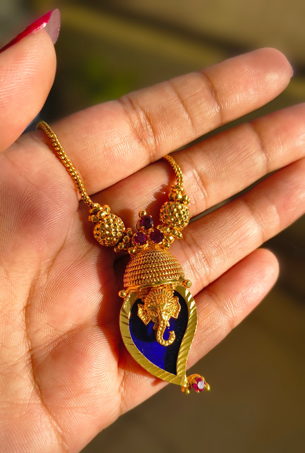 Traditional Handpicked Simple and elegance Ganesh pendant necklace with premium gold finish and royal detailing Jewellery.