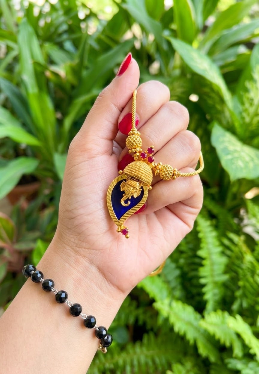 Traditional Handpicked Simple and elegance Ganesh pendant necklace with premium gold finish and royal detailing Jewellery.
