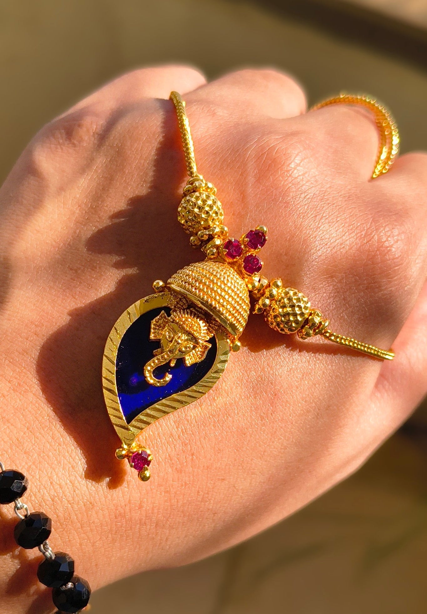 Traditional Handpicked Simple and elegance Ganesh pendant necklace with premium gold finish and royal detailing Jewellery.